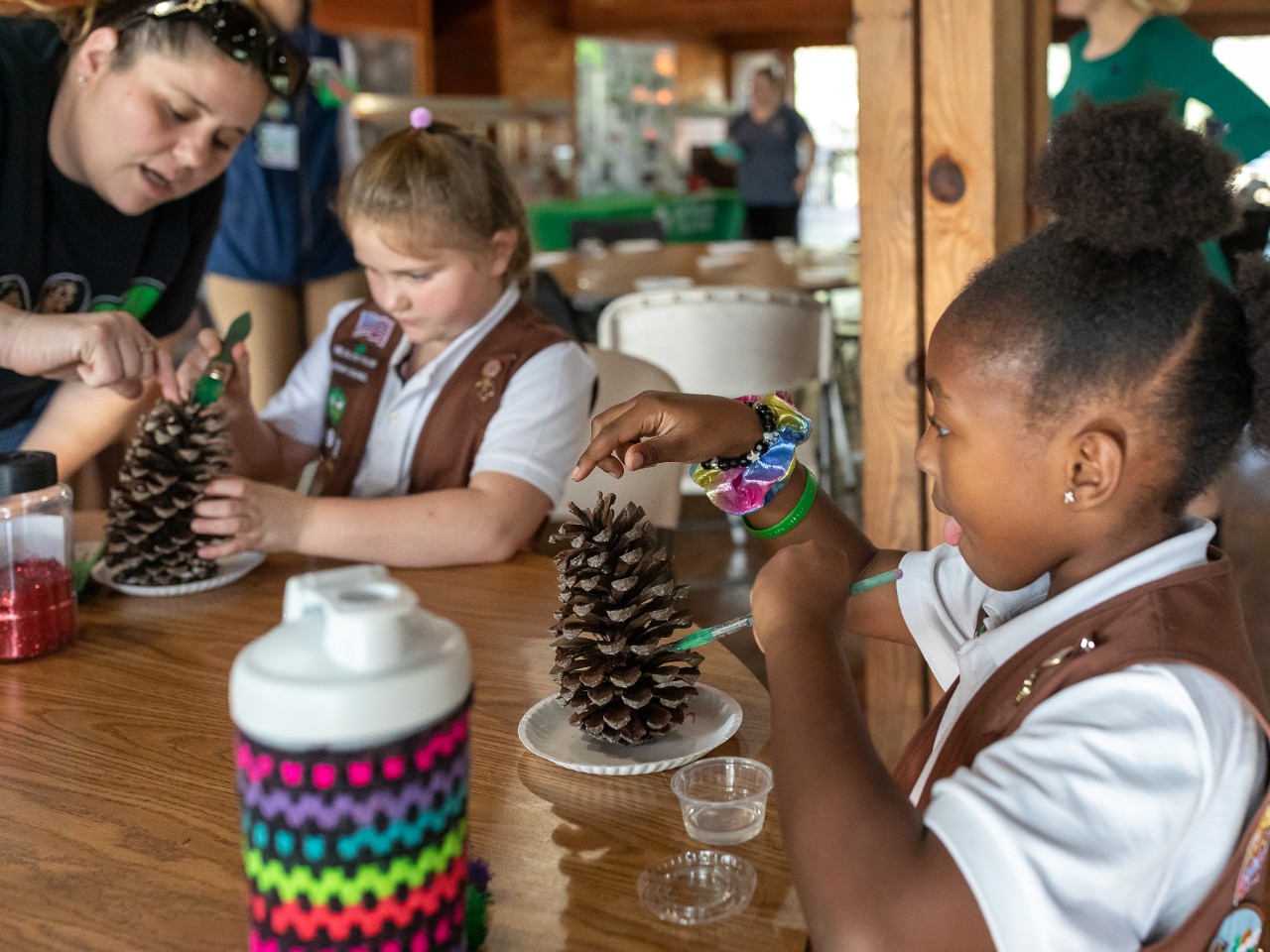 Girl Scout at camp doing a craft activity