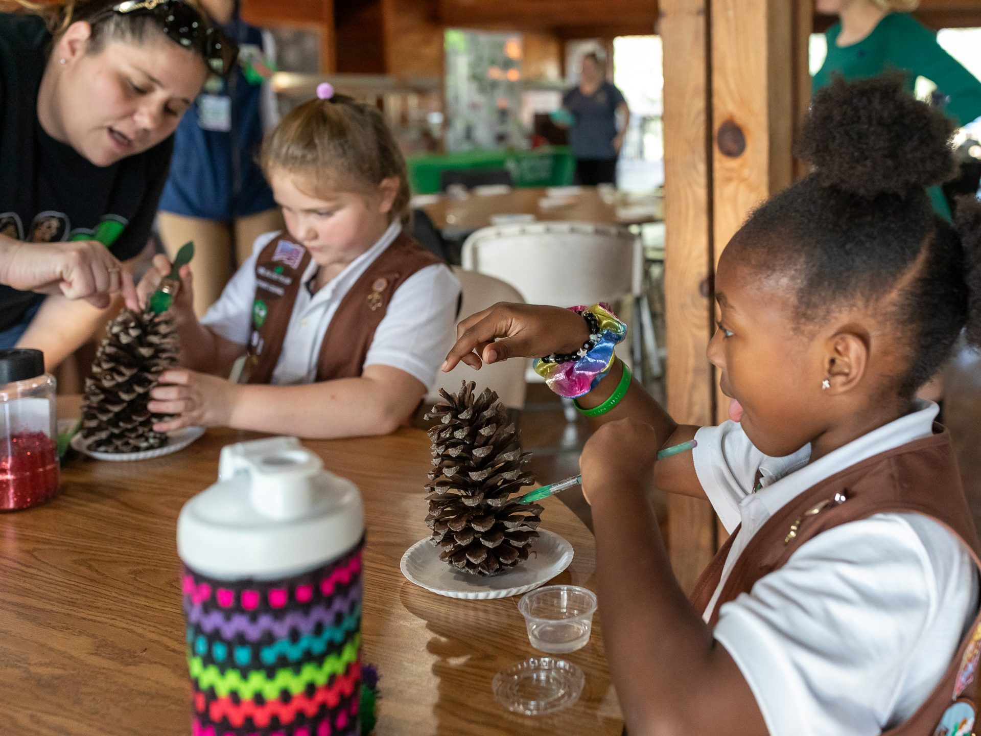 Girl Scout at camp doing a craft activity
