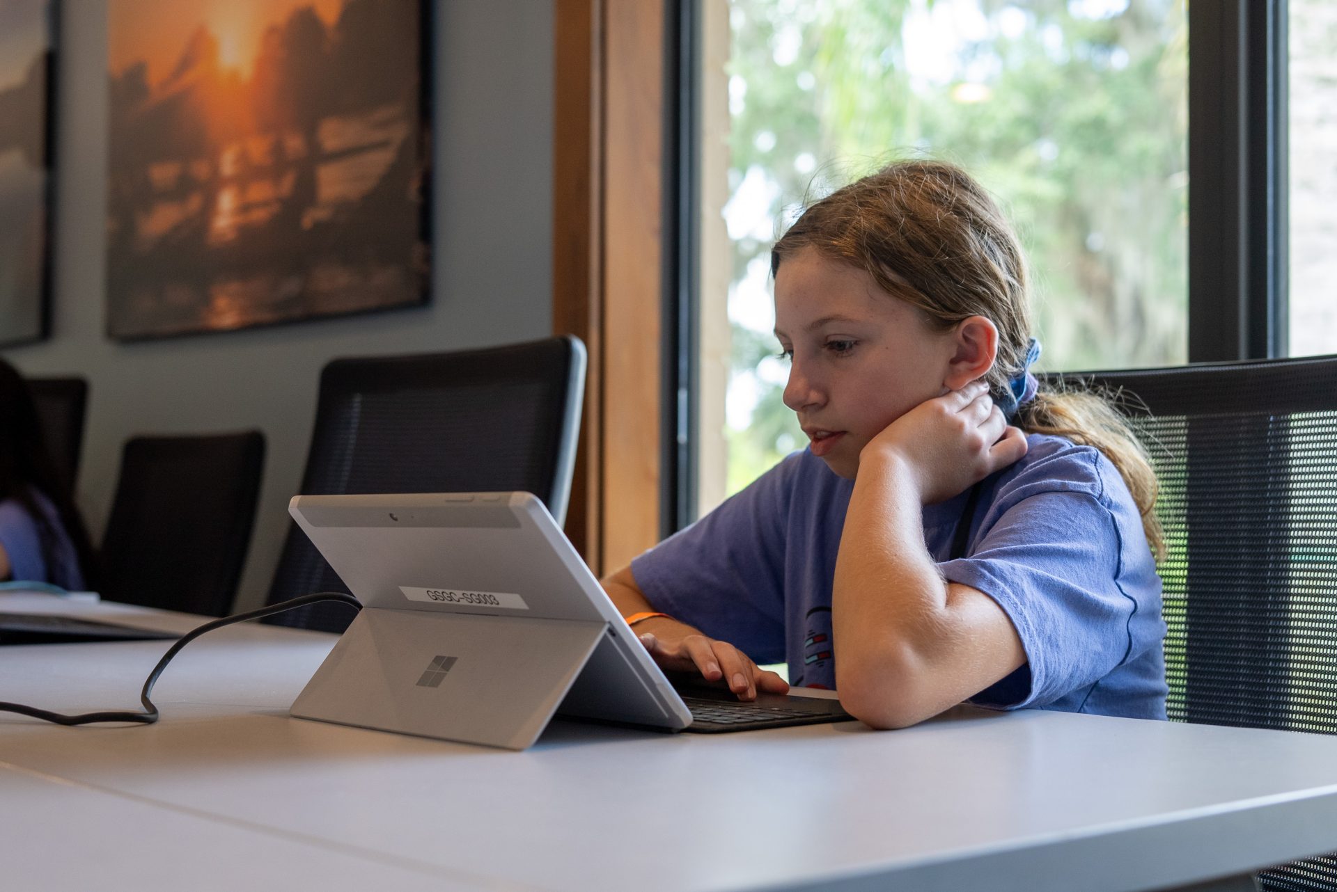  group of girl scouts looking at laptop computer 