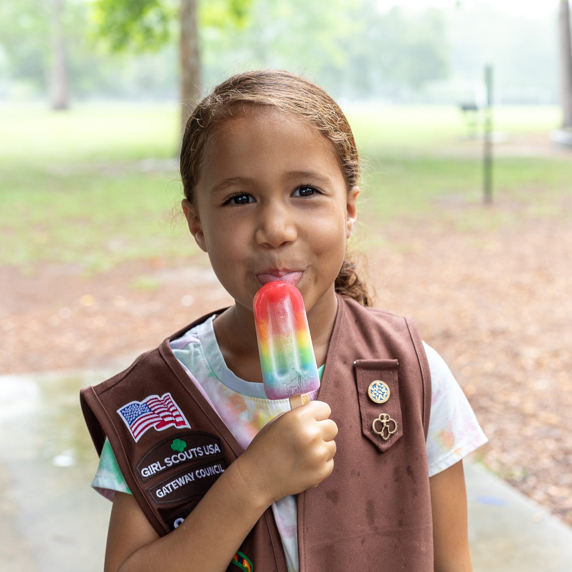 girl holding popsicle