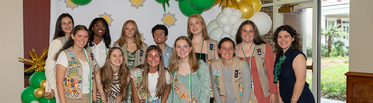  high school gold award girl scout with natural hair wearing ambassador vest 